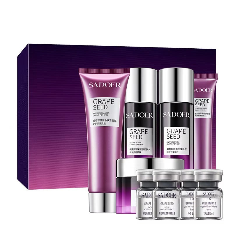Sadoer grape seed skincare product set with bottles and jars on a purple background