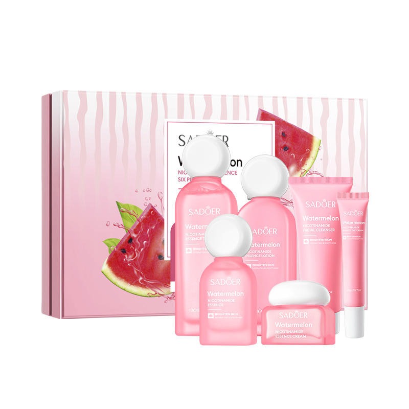 Skincare set with watermelon theme featuring pink bottles and packaging on a white background.