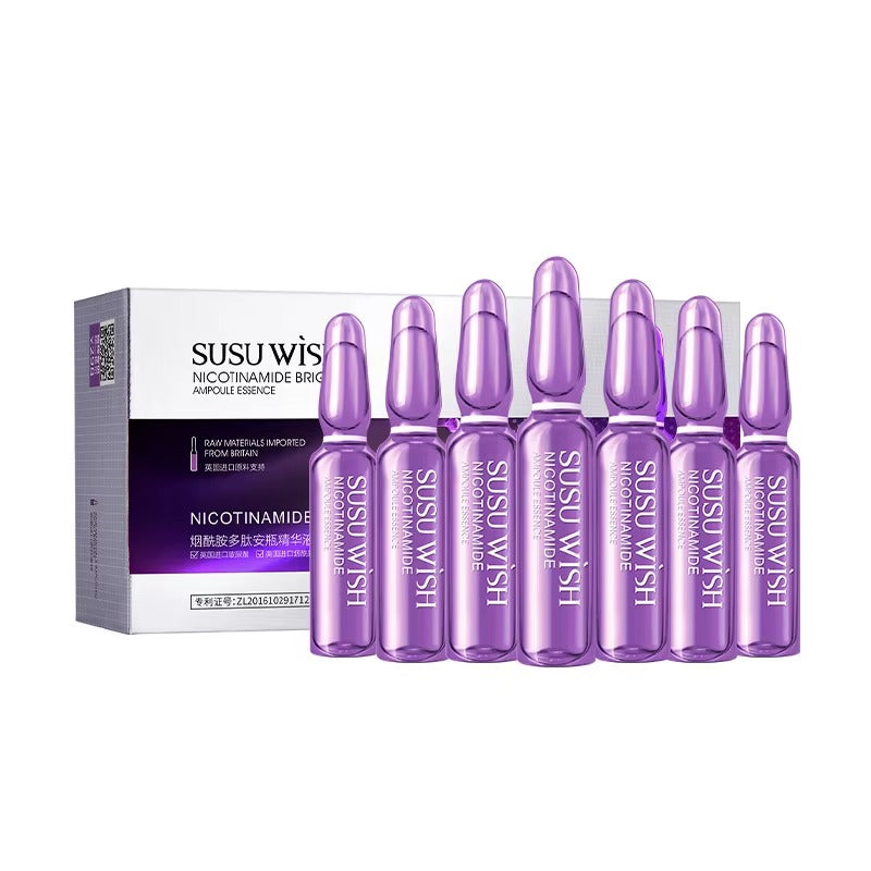Purple skincare ampoules with Susu Wiset packaging on a white background
