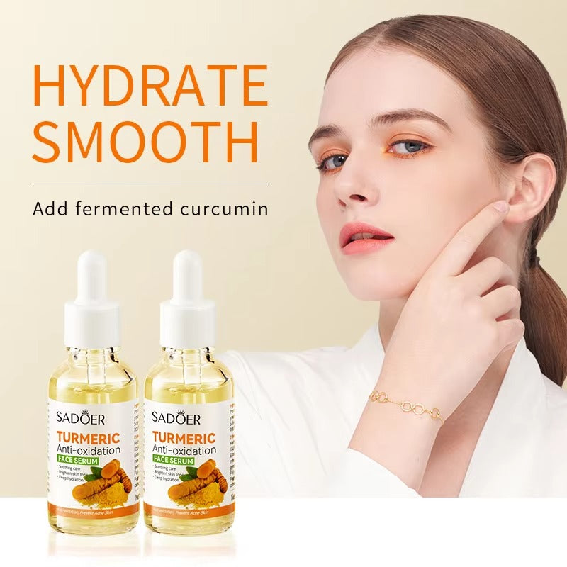Two bottles of Sadeer Turmeric Anti-oxidation Face Serum with a woman pointing to her face on a beige background.