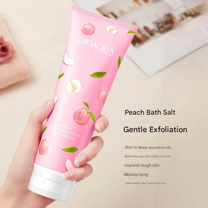 Pink tube of BIOAQUA Peach Bath Salt with text on a blurred background